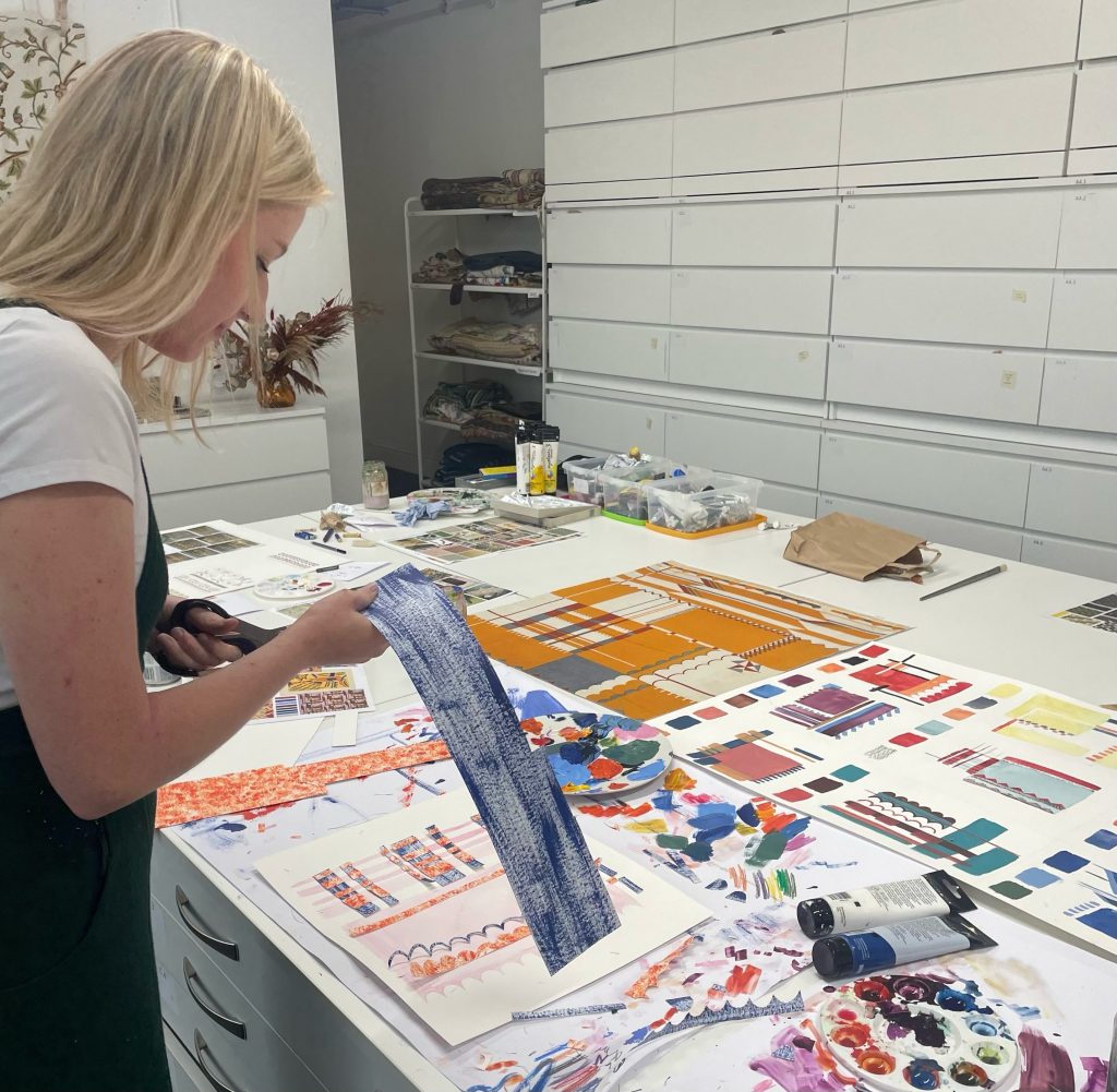 About me A female looking at moodboards and colour samples