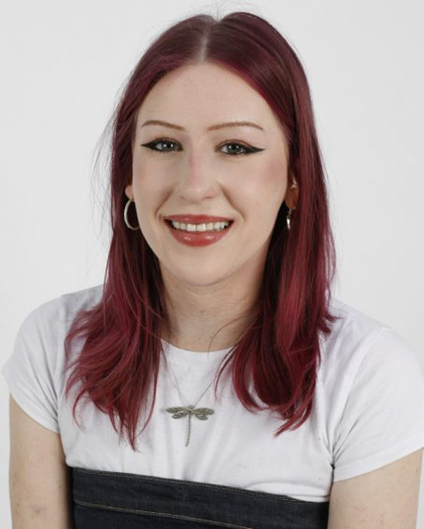 Millie Inman wearing a white top